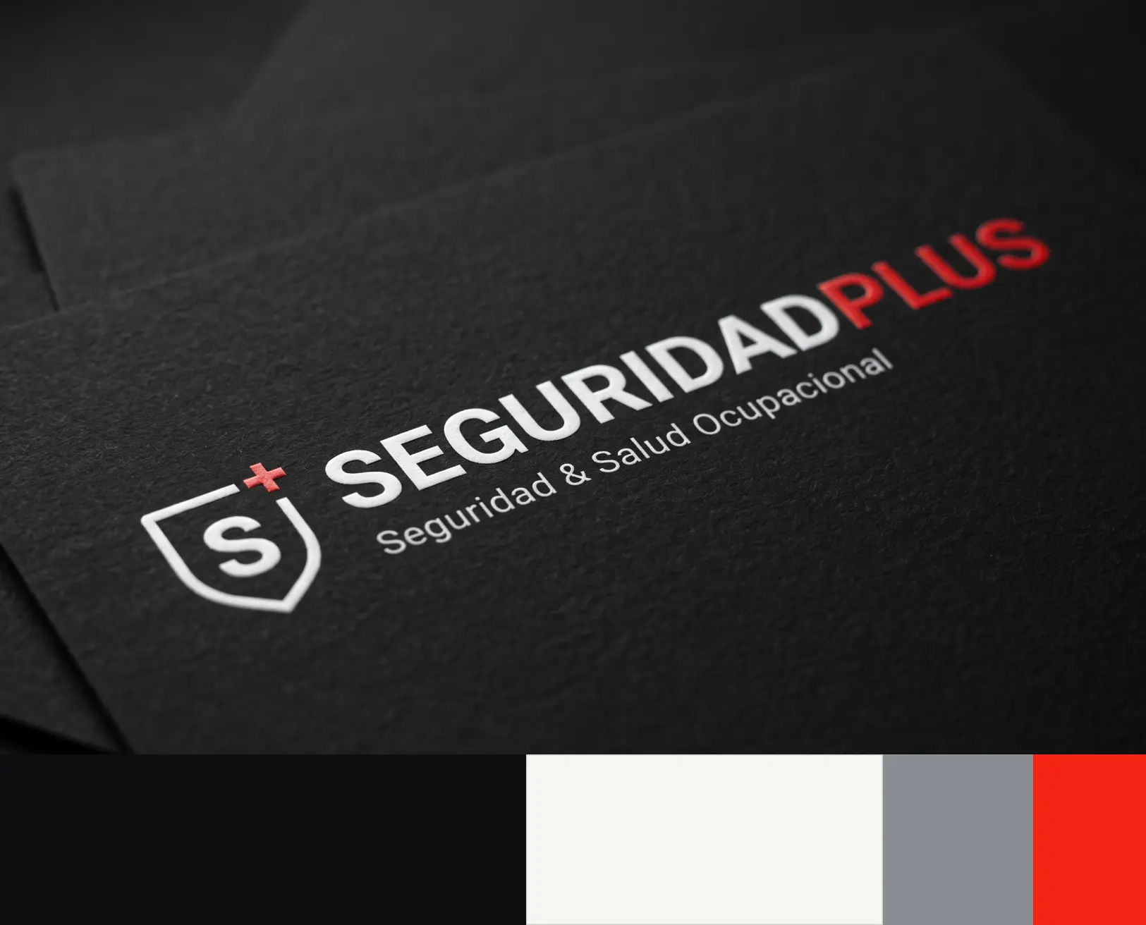 Paleta cromática de SeguridadPlus: negro carbón, rojo alerta, blanco hueso y gris acero